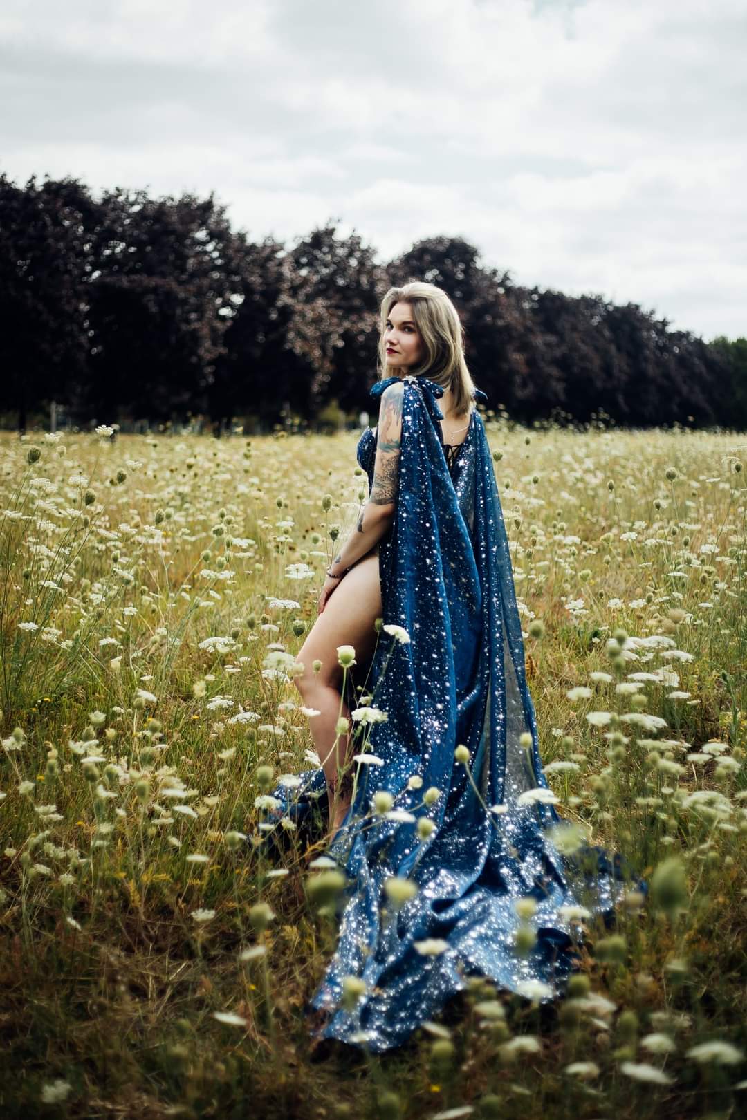 Beautiful celestial cape with a jewelry statement back piece.