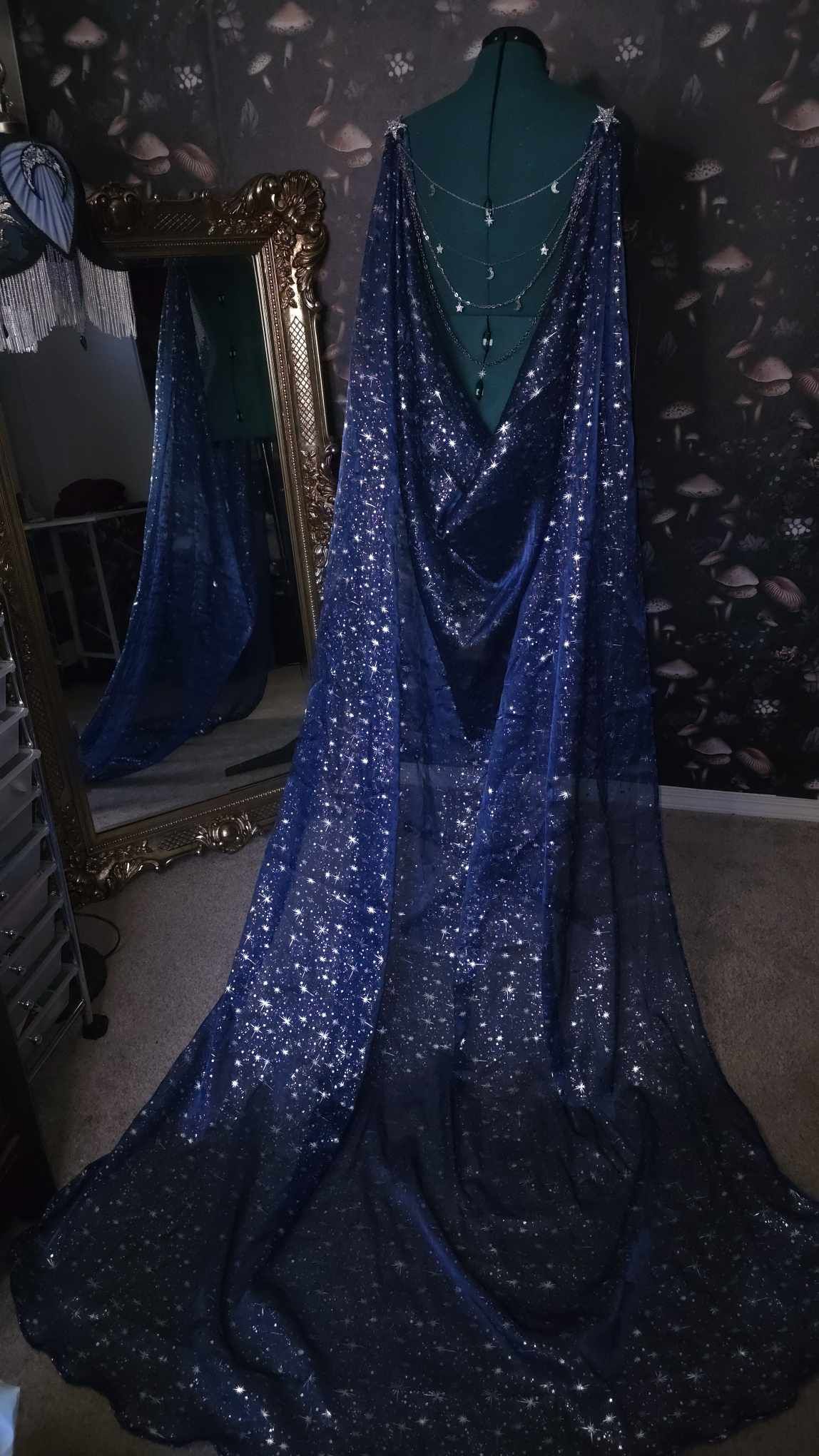 Beautiful celestial cape with a jewelry statement back piece.