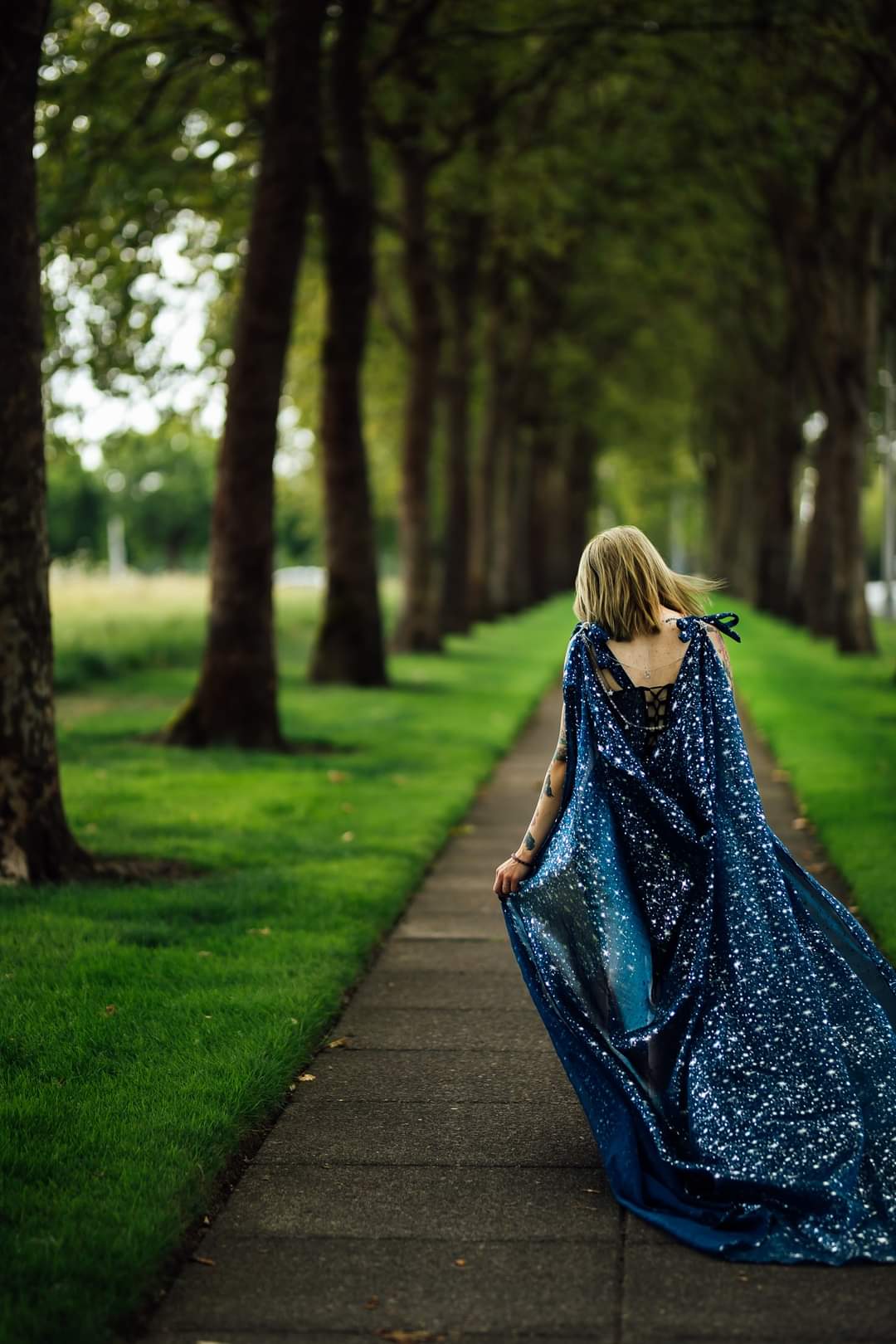 Beautiful celestial cape with a jewelry statement back piece.